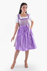 Purple dirndl with lace bodice and white puffed sleeves, ready for Bavarian celebrations