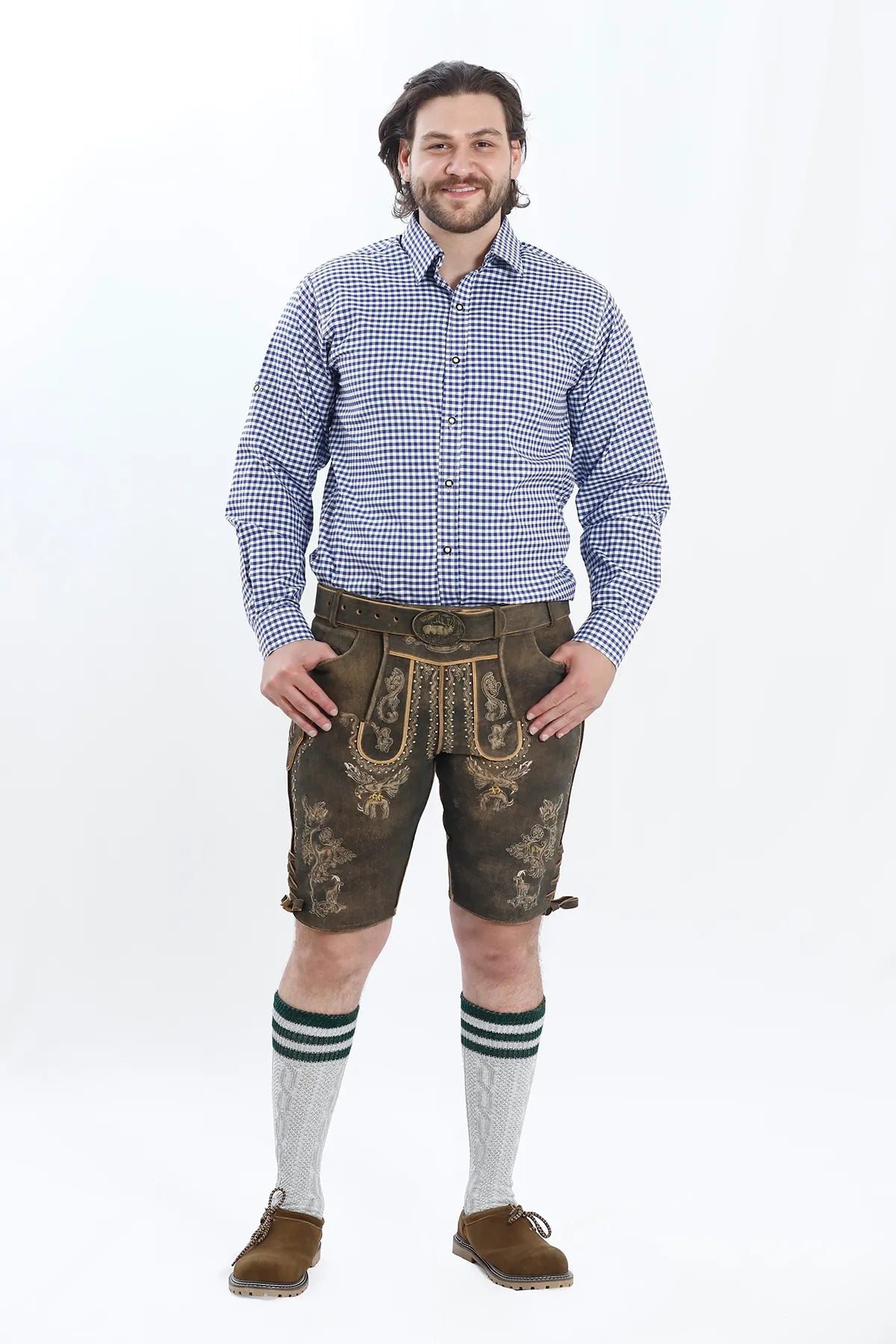 Lederhosen Men in Brown Color with Traditional Embroidery. Model is wearing Blue Checkered shirt and Traditional Bavarian Shoes.