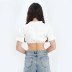 White cotton dirndl blouse with short puffed sleeves and gathered square neckline with ruffle trim