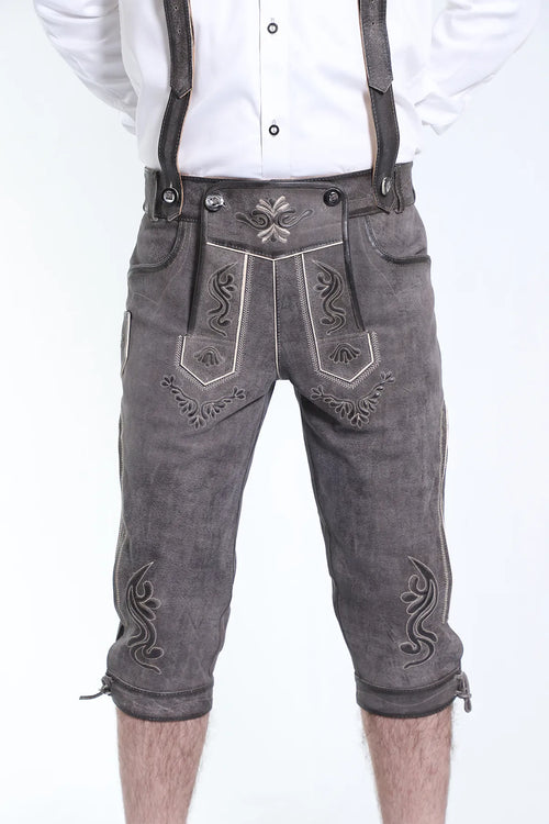 Dark gray suede Bundhosen with scrollwork embroidery in white and silver, decorative bib with leather belt