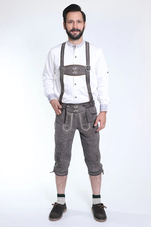 Dark gray suede Bundhosen with scrollwork embroidery in white and silver, decorative bib with leather belt