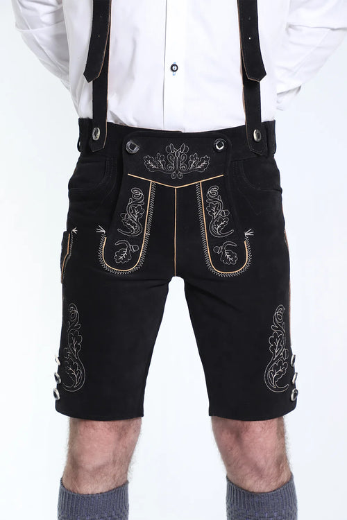 Jet black suede shorts with cream vine embroidery, ornate bibs, and black leather braces included