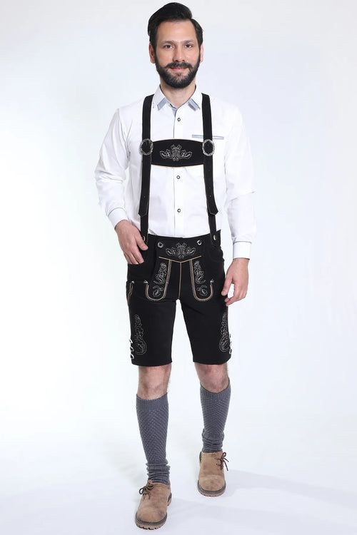 Jet black suede shorts with cream vine embroidery, ornate bibs, and black leather braces included
