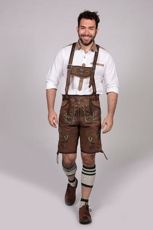 Brown leather shorts with stag and vine embroidery in green and cream, ornate bib with scrollwork
