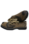 Light brown suede shoes with black trim, rope laces, and a thick crepe sole for Bavarian folk wear