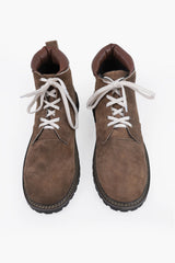 Tan suede lace-up boots with cream rope laces, dark sole, and padded collar for Alpine wear
