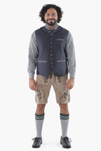 Charcoal black wool vest with button front, chest pocket, and refined tailoring for Alpine tradition
