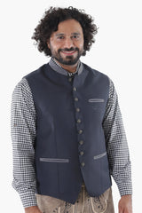 Charcoal black wool vest with button front, chest pocket, and refined tailoring for Alpine tradition