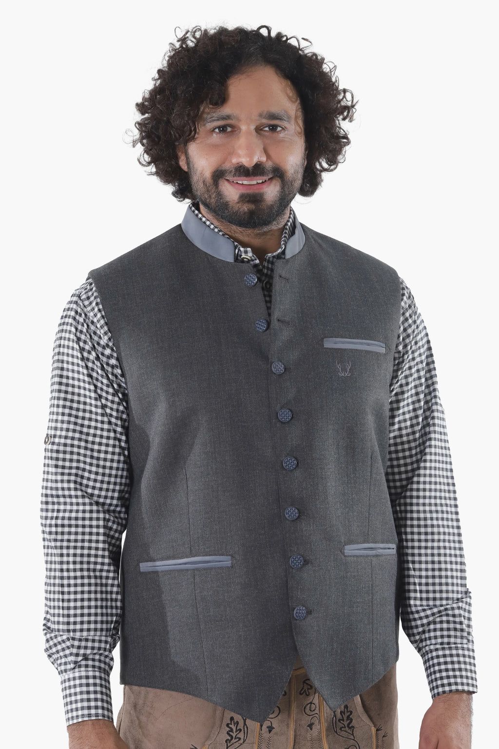 Steel grey wool vest with button front, breast pockets, and subtle grey piping for Alpine traditionSteel grey wool vest with button front, breast pockets, and subtle grey piping for Alpine tradition
