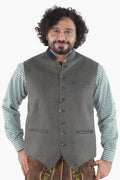 Forest green wool vest with dark leather trim, button front, and chest pockets for traditional Bavarian wear