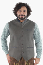 Forest green wool vest with dark leather trim, button front, and chest pockets for traditional Bavarian wear